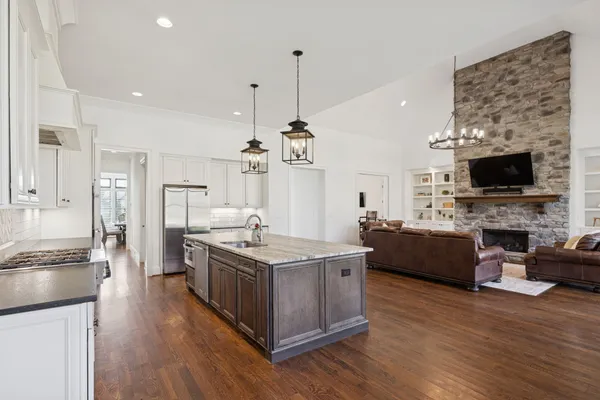 a kitchen with a large window and a table