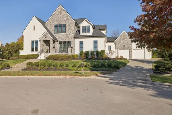 a view of an entryway with wooden floor and windows