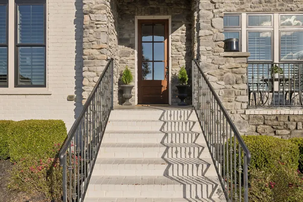 a room with furniture a rug toys and a window