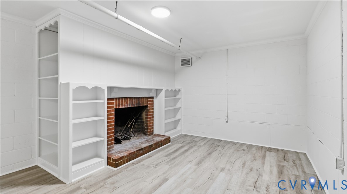 2301 Traymore Road North Chesterfield, VA 23235 - Photo 48 of 67 Brick fireplace with hearth, built-in shelving, wo