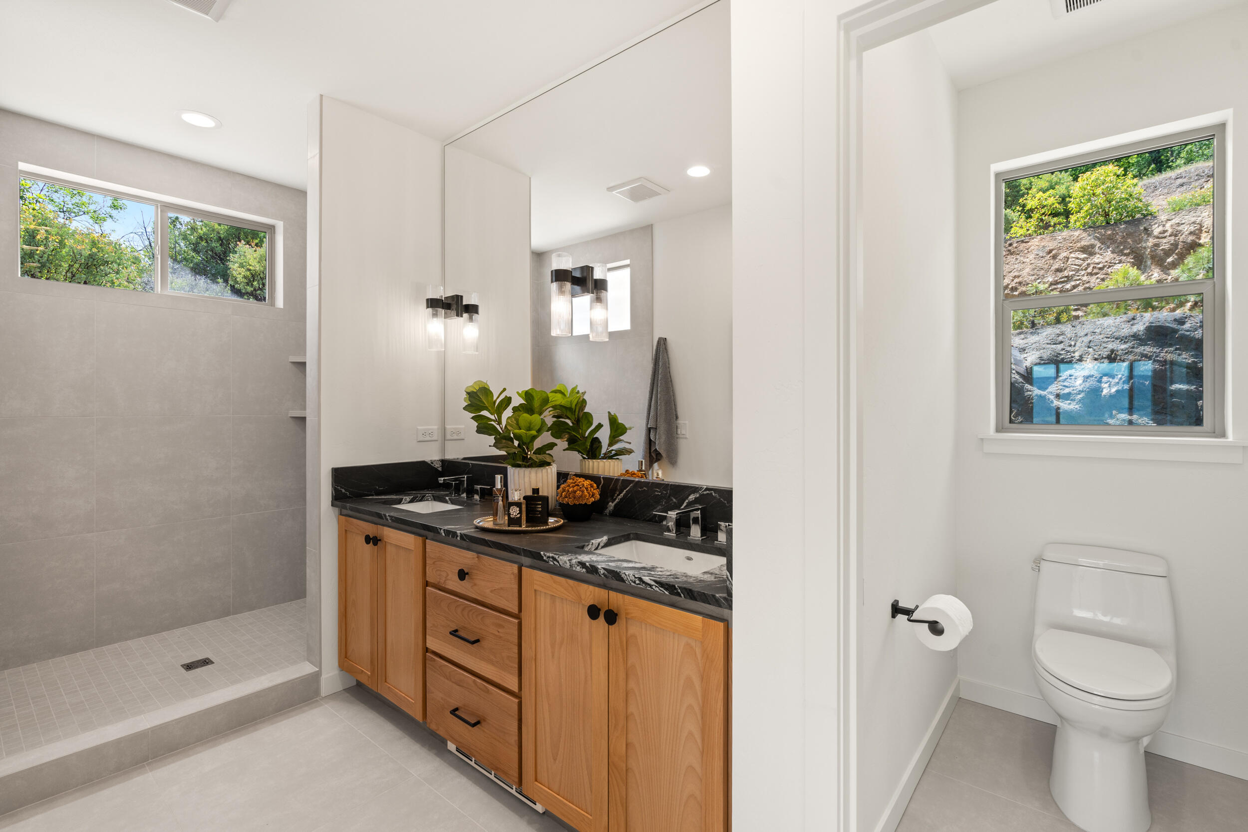 3060 Ashland Mine Road Talent, OR 97540 - Photo 21 of 43 a bathroom with a granite countertop sink a toilet a large mirror and shower