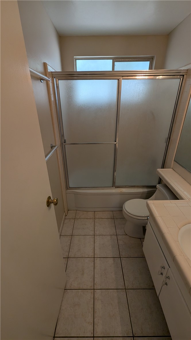 2566 Flanders Road Riverside, CA 92507 - Photo 11 of 16 a bathroom with a toilet and a shower
