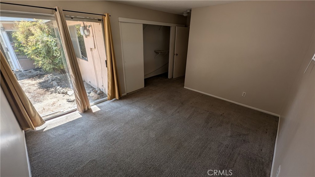 2566 Flanders Road Riverside, CA 92507 - Photo 12 of 16 a view of livingroom with floor to ceiling window
