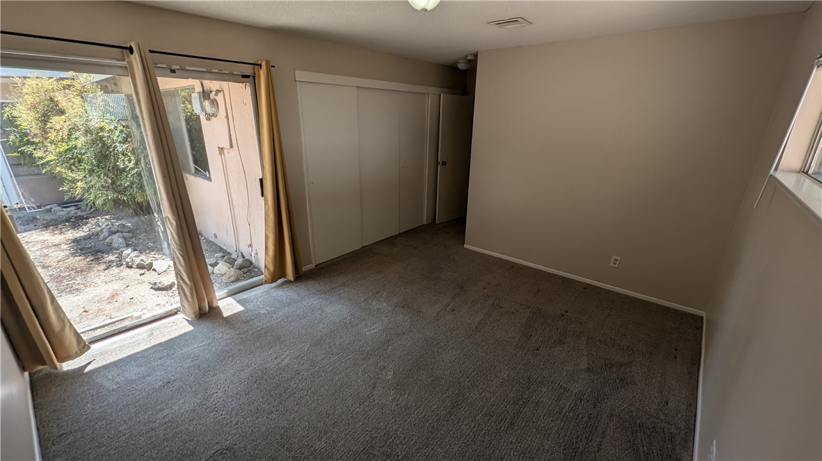 2566 Flanders Road Riverside, CA 92507 - Photo 13 of 16 an empty room with windows