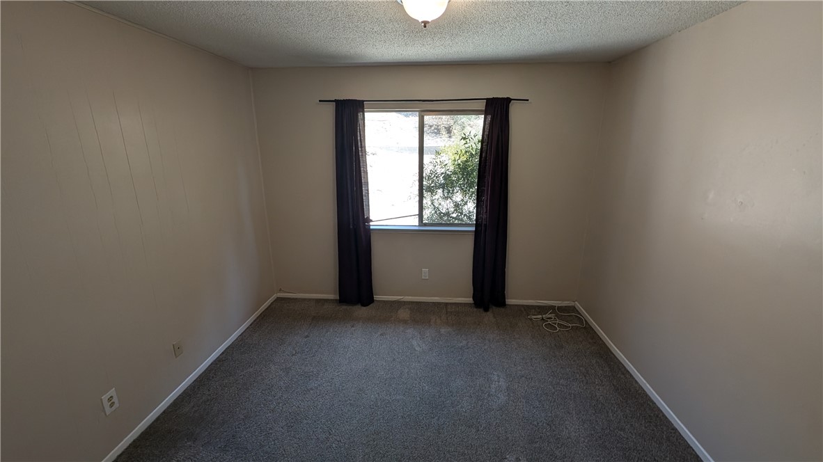 2566 Flanders Road Riverside, CA 92507 - Photo 8 of 16 an empty room with windows
