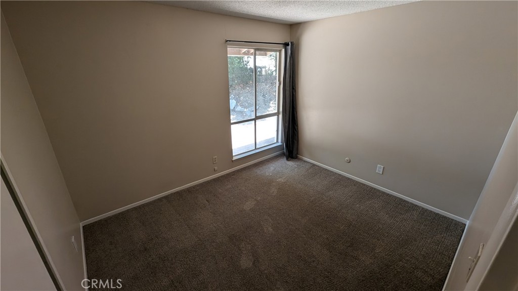2566 Flanders Road Riverside, CA 92507 - Photo 10 of 16 an empty room with windows