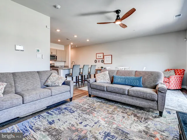 a living room with furniture or kitchen view and a couch