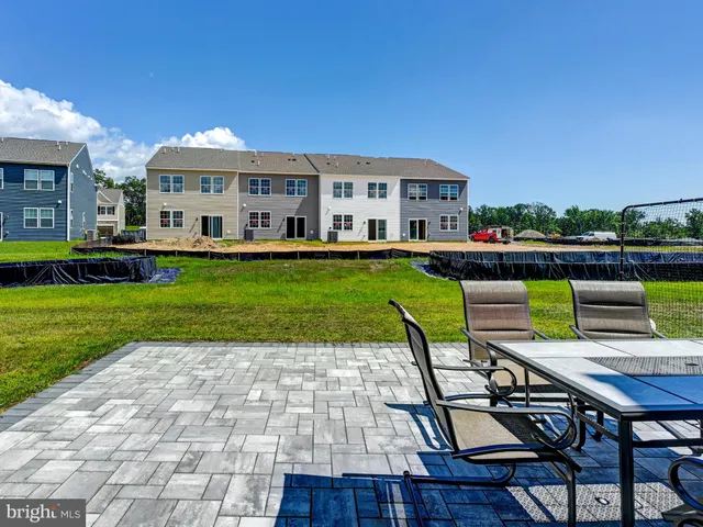 a backyard of a house with seating space