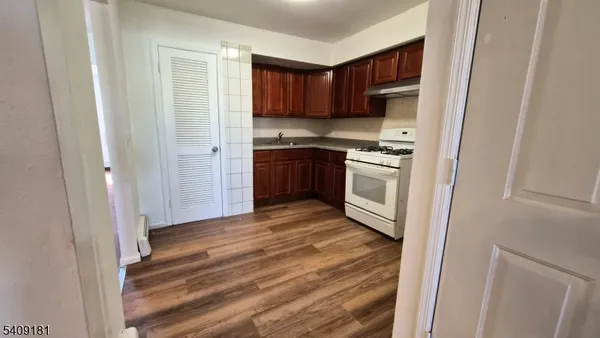 a kitchen with a refrigerator stove and a sink