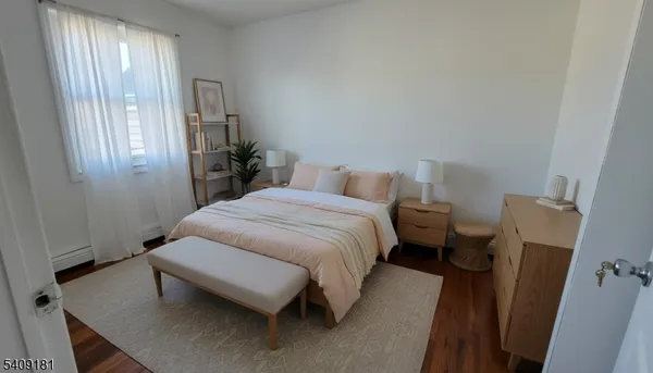 a bedroom with a bed and a mirror