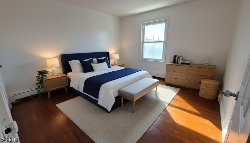 536 Livingston Street Elizabeth Port, NJ 07206 - Photo 7 of 14 a bed room with a bed and a window