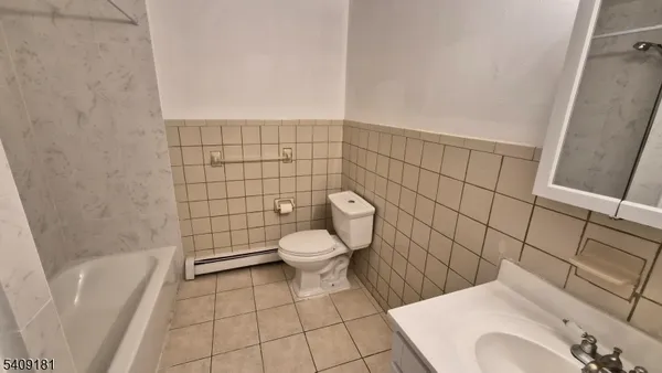 a bathroom with a sink and toilet