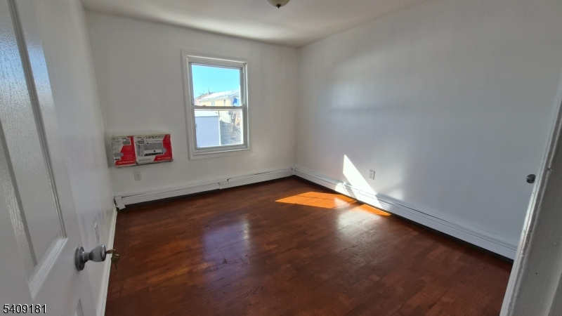 536 Livingston Street Elizabeth Port, NJ 07206 - Photo 10 of 14 an empty room with an empty space
