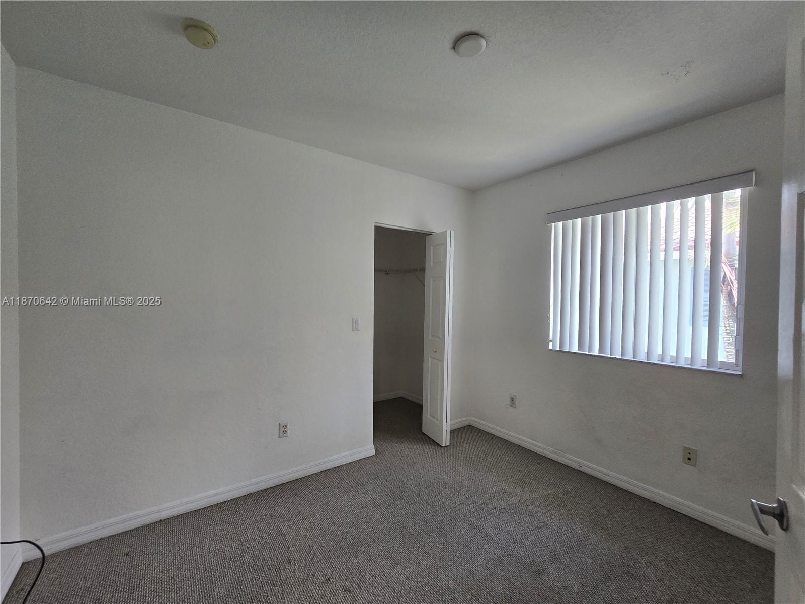 3632 Oleander Terrace, Unit 3632 Riviera Beach, FL 33404 - Photo 14 of 26 an empty room with a window