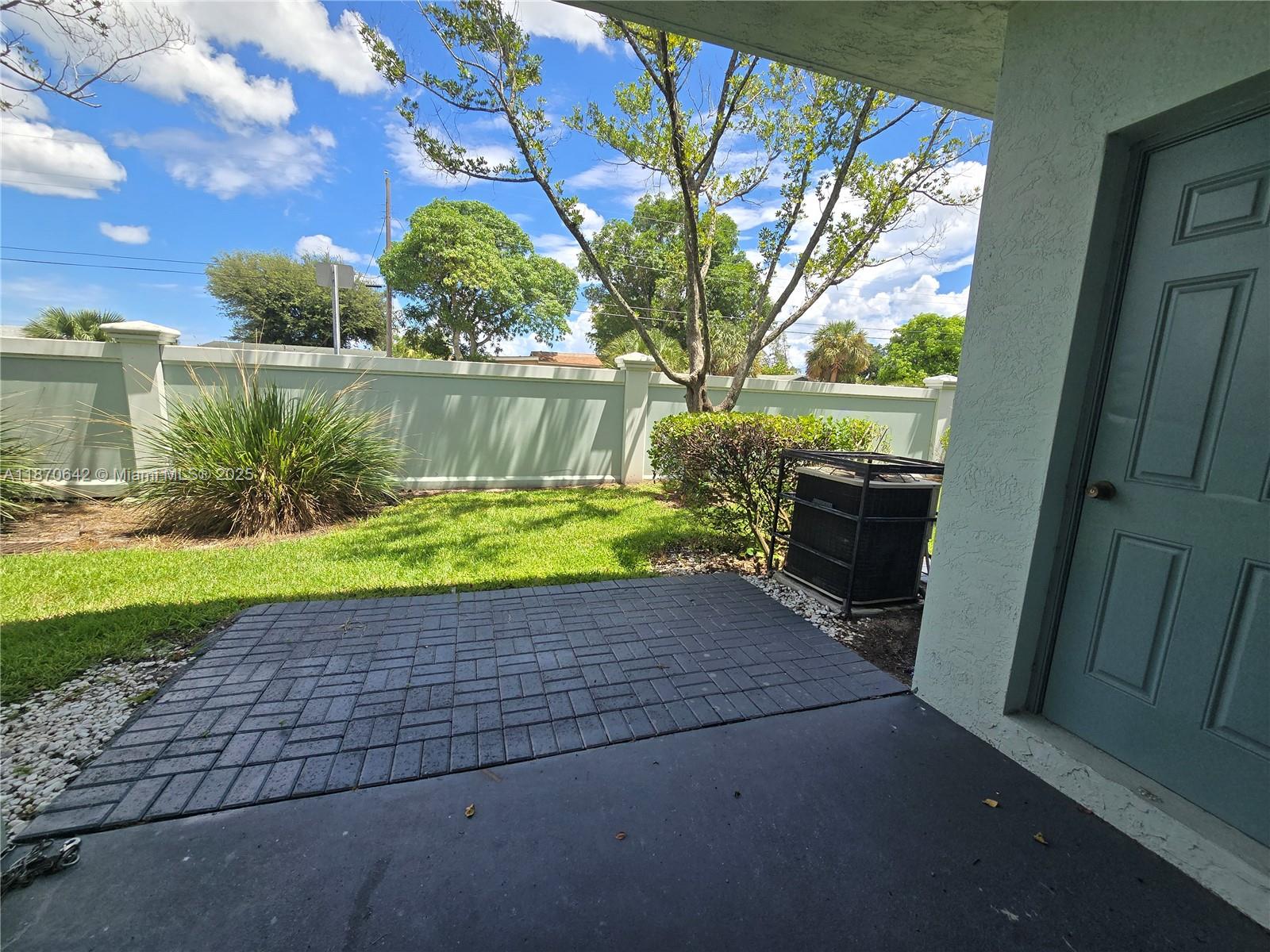 3632 Oleander Terrace, Unit 3632 Riviera Beach, FL 33404 - Photo 17 of 26 a view of backyard with outdoor seating and plants