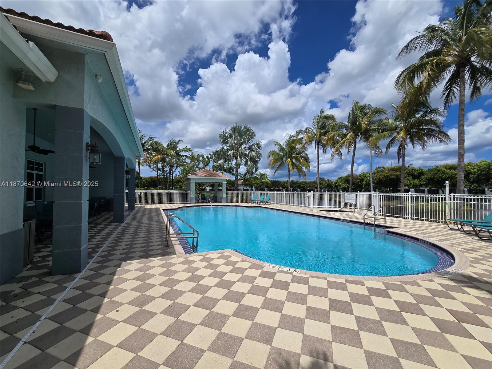 3632 Oleander Terrace, Unit 3632 Riviera Beach, FL 33404 - Photo 23 of 26 a view of swimming pool with a lounge chair