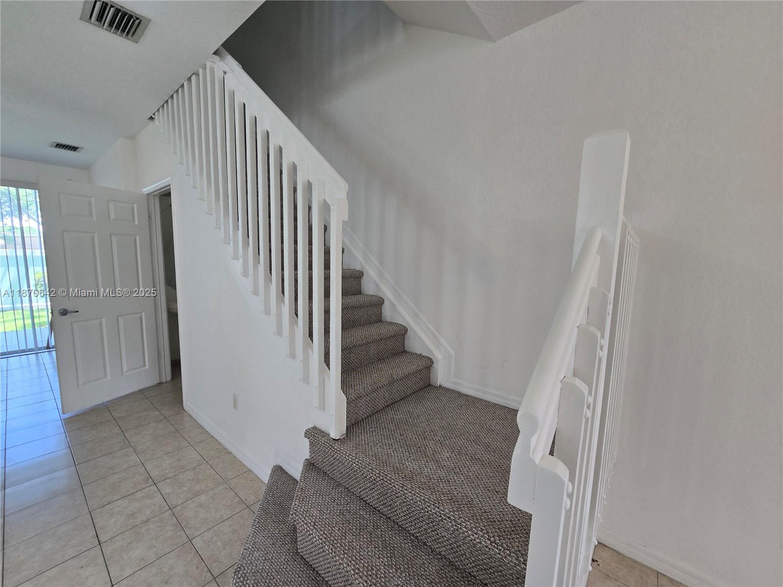 3632 Oleander Terrace, Unit 3632 Riviera Beach, FL 33404 - Photo 8 of 26 a view of entryway and hall with wooden floor