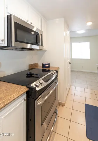 a kitchen with a sink and a microwave