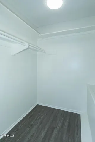 a bathroom with a granite countertop sink mirror toilet and bathtub