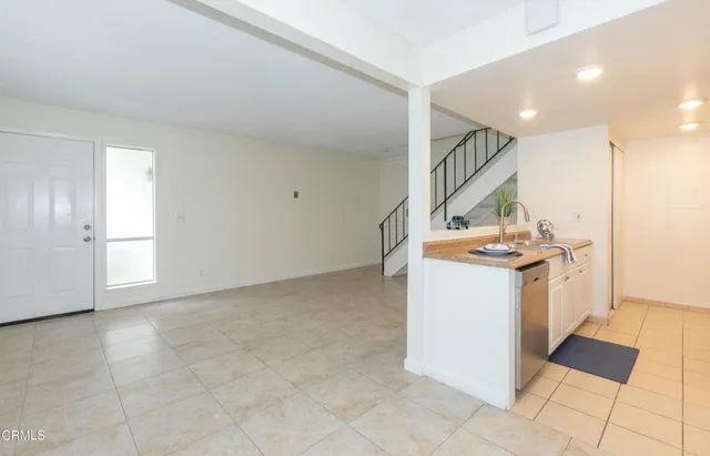 a view of an entryway with wooden floor