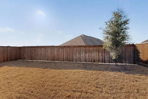 a view of a house with sitting area and garden