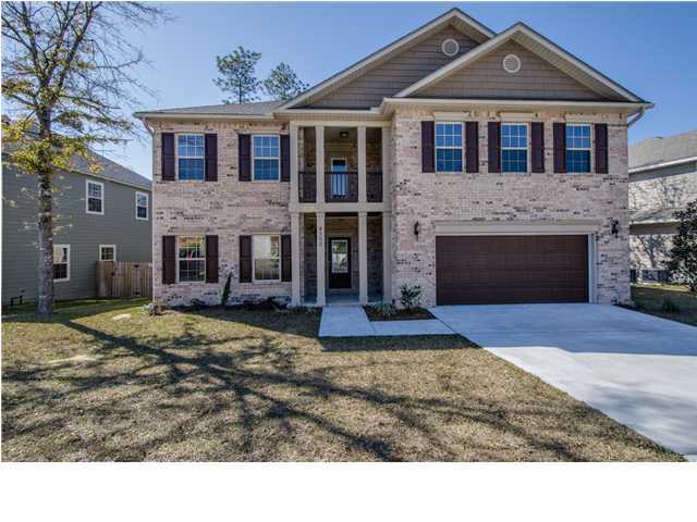 4560 Hermosa Road Crestview, FL 32539 - Photo 1 of 26 a front view of a house with a yard