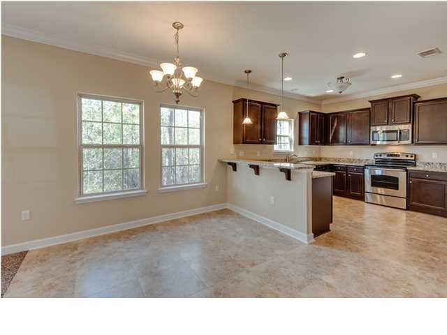 4560 Hermosa Road Crestview, FL 32539 - Photo 11 of 26 a kitchen with kitchen island granite countertop a stove top oven a sink dishwasher a dining table and chairs
