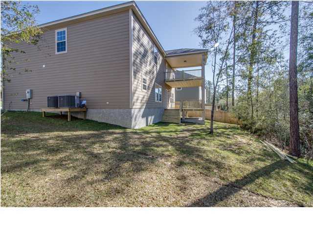 4560 Hermosa Road Crestview, FL 32539 - Photo 25 of 26 a backyard of a house with lots of green space
