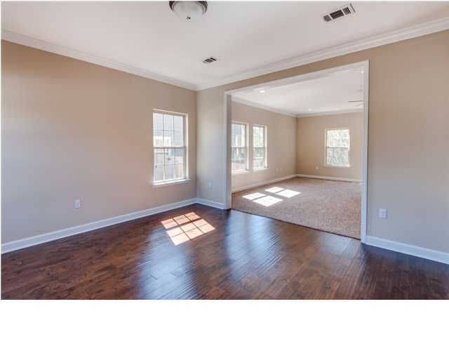 4560 Hermosa Road Crestview, FL 32539 - Photo 8 of 26 a open hall with wooden floor and windows