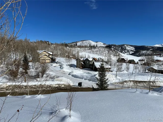 a view of a backyard of the house