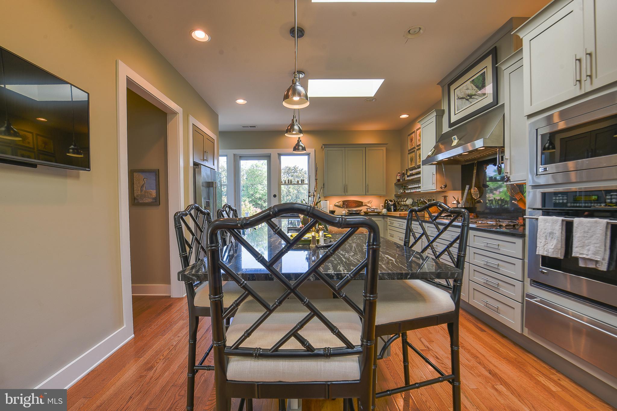 38520 Pine Lane, Unit 2 Rehoboth Beach, DE 19971 - Photo 16 of 71 a view of a dining room with furniture and a kitchen