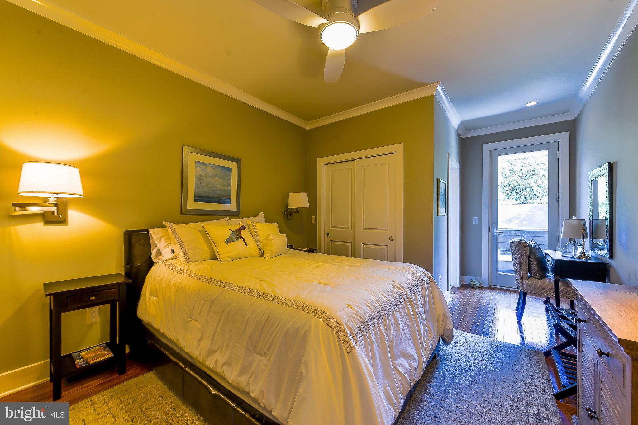 38520 Pine Lane, Unit 2 Rehoboth Beach, DE 19971 - Photo 23 of 71 a bedroom with a bed and wooden floor