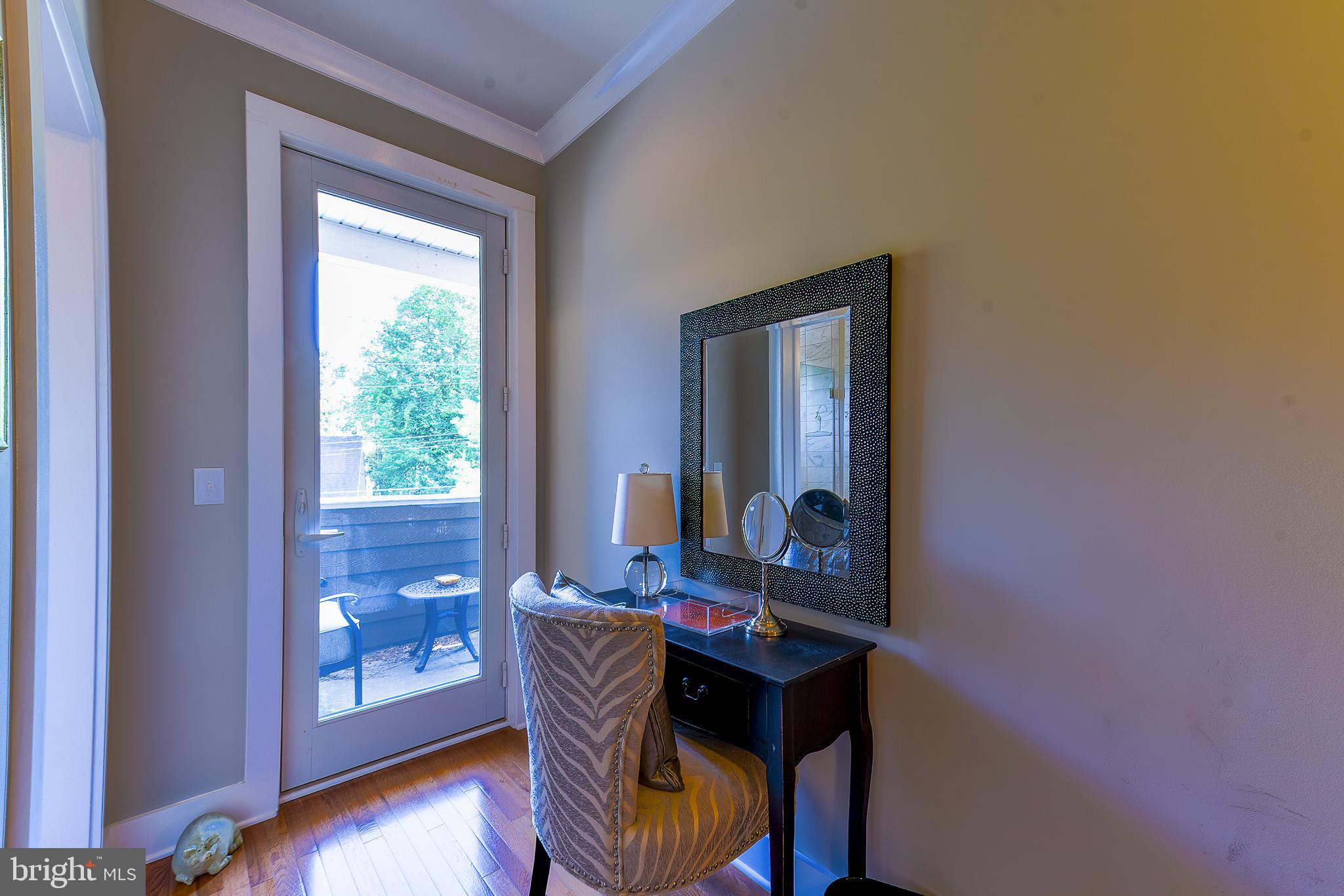 38520 Pine Lane, Unit 2 Rehoboth Beach, DE 19971 - Photo 25 of 71 a dining room with furniture and wooden floor