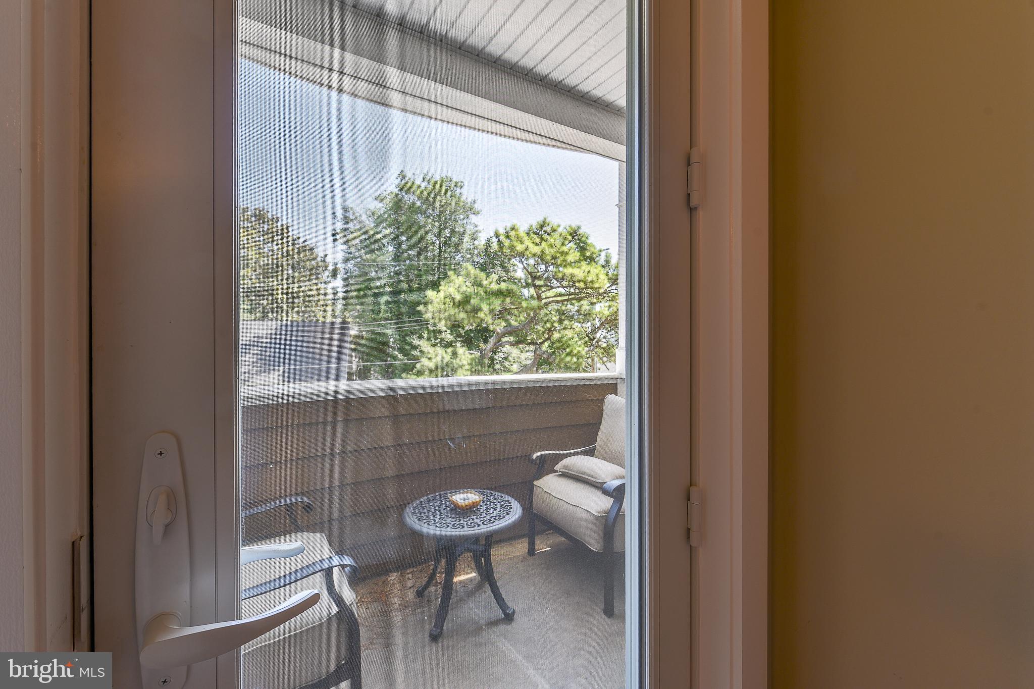 38520 Pine Lane, Unit 2 Rehoboth Beach, DE 19971 - Photo 27 of 71 a view of a room that has a bench in it
