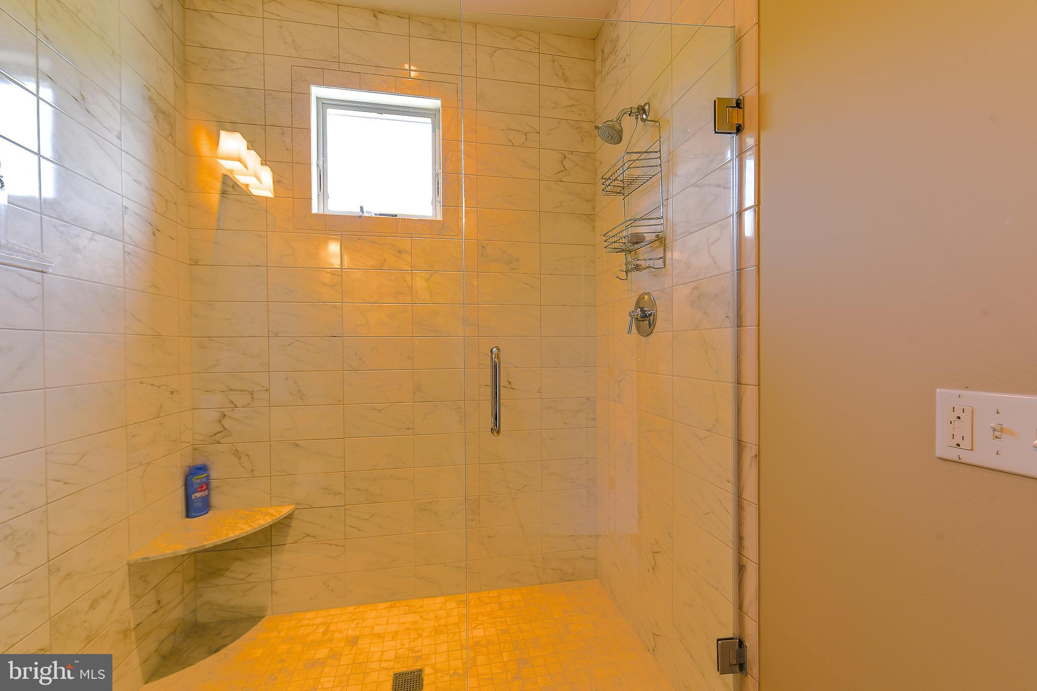 38520 Pine Lane, Unit 2 Rehoboth Beach, DE 19971 - Photo 28 of 71 a bathroom with a shower