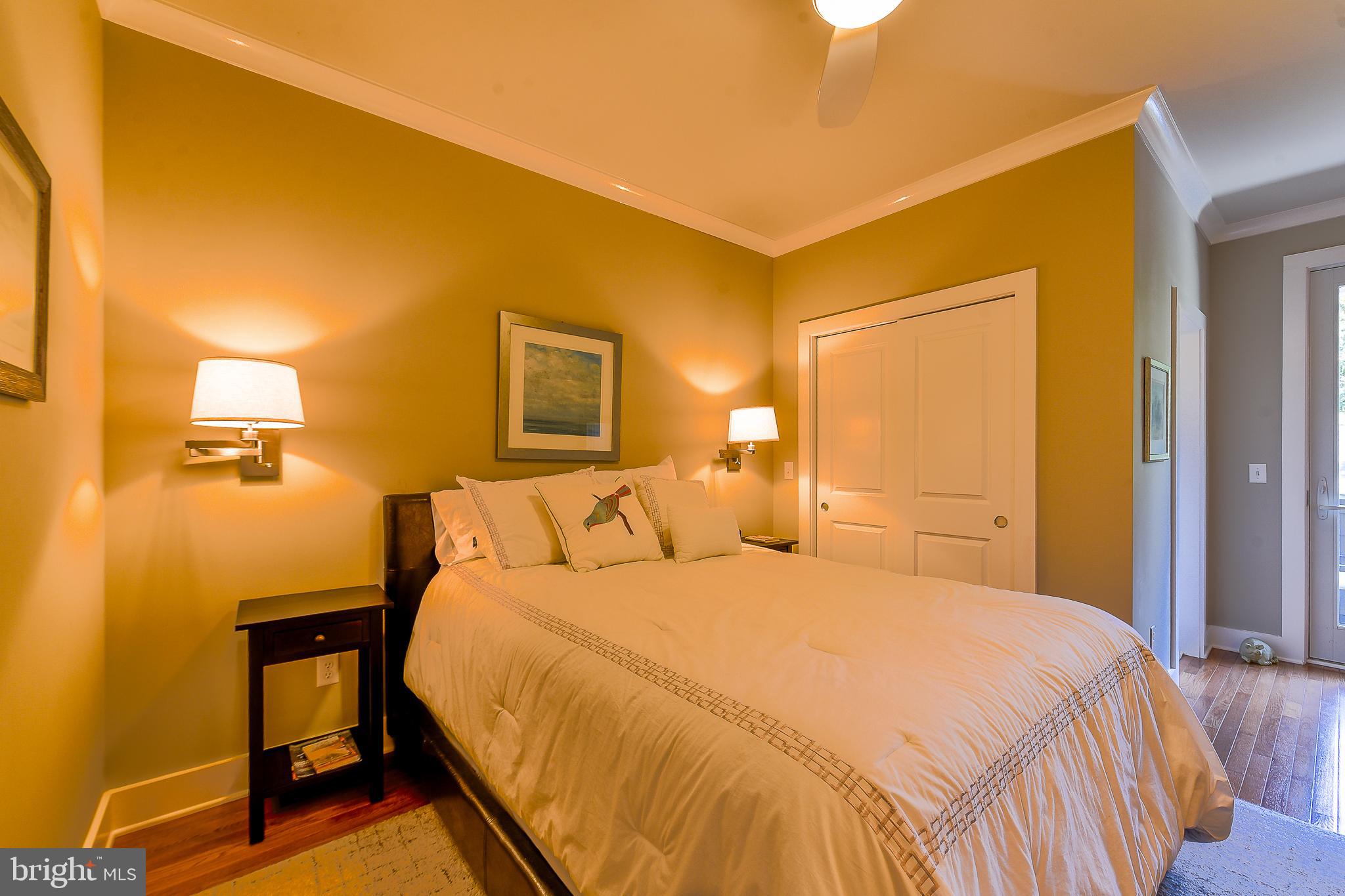 38520 Pine Lane, Unit 2 Rehoboth Beach, DE 19971 - Photo 30 of 71 a bedroom with a bed and a table