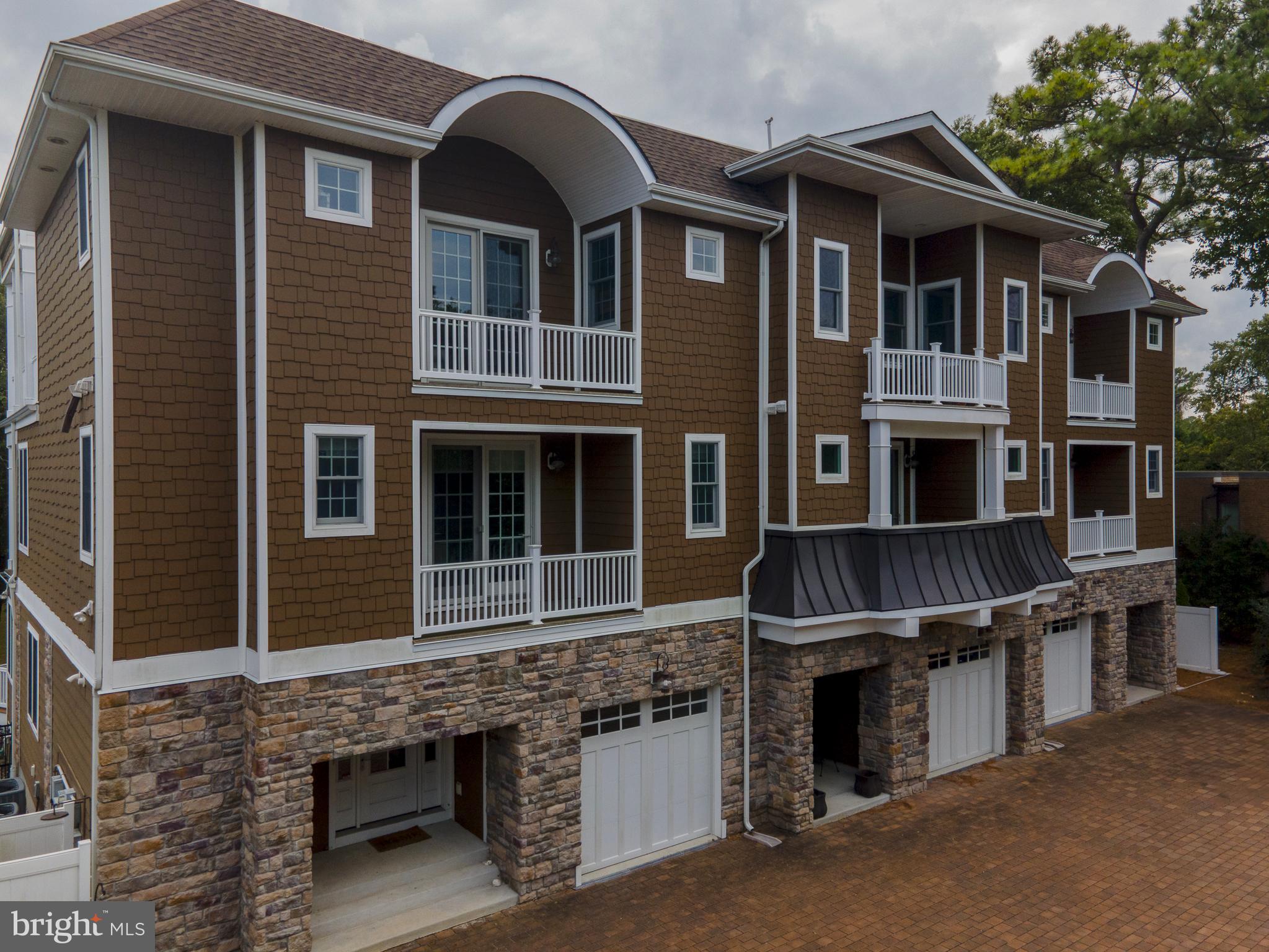 38520 Pine Lane, Unit 2 Rehoboth Beach, DE 19971 - Photo 3 of 71 a front view of a house with glass windows