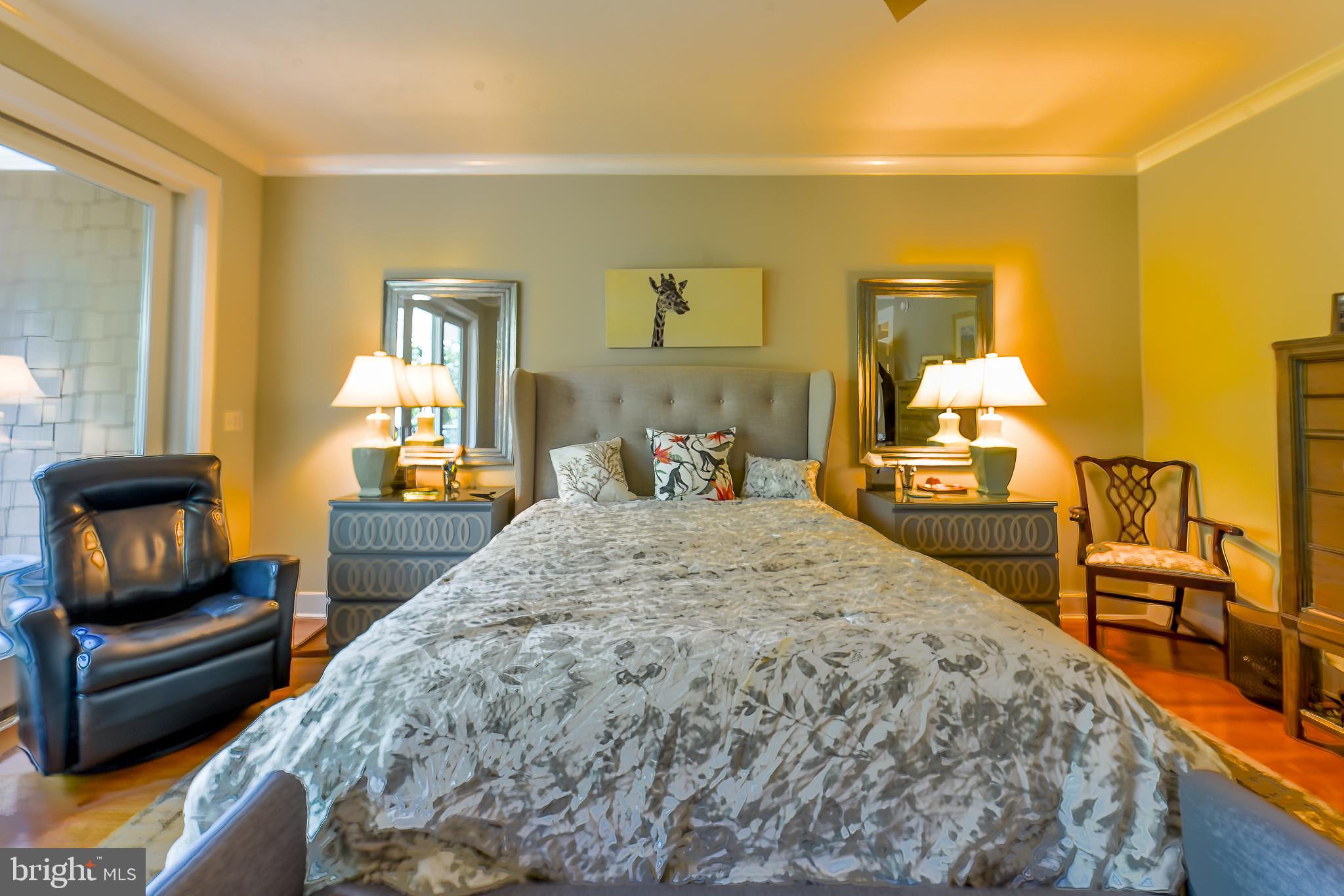 38520 Pine Lane, Unit 2 Rehoboth Beach, DE 19971 - Photo 38 of 71 a bedroom with a bed and wooden floor