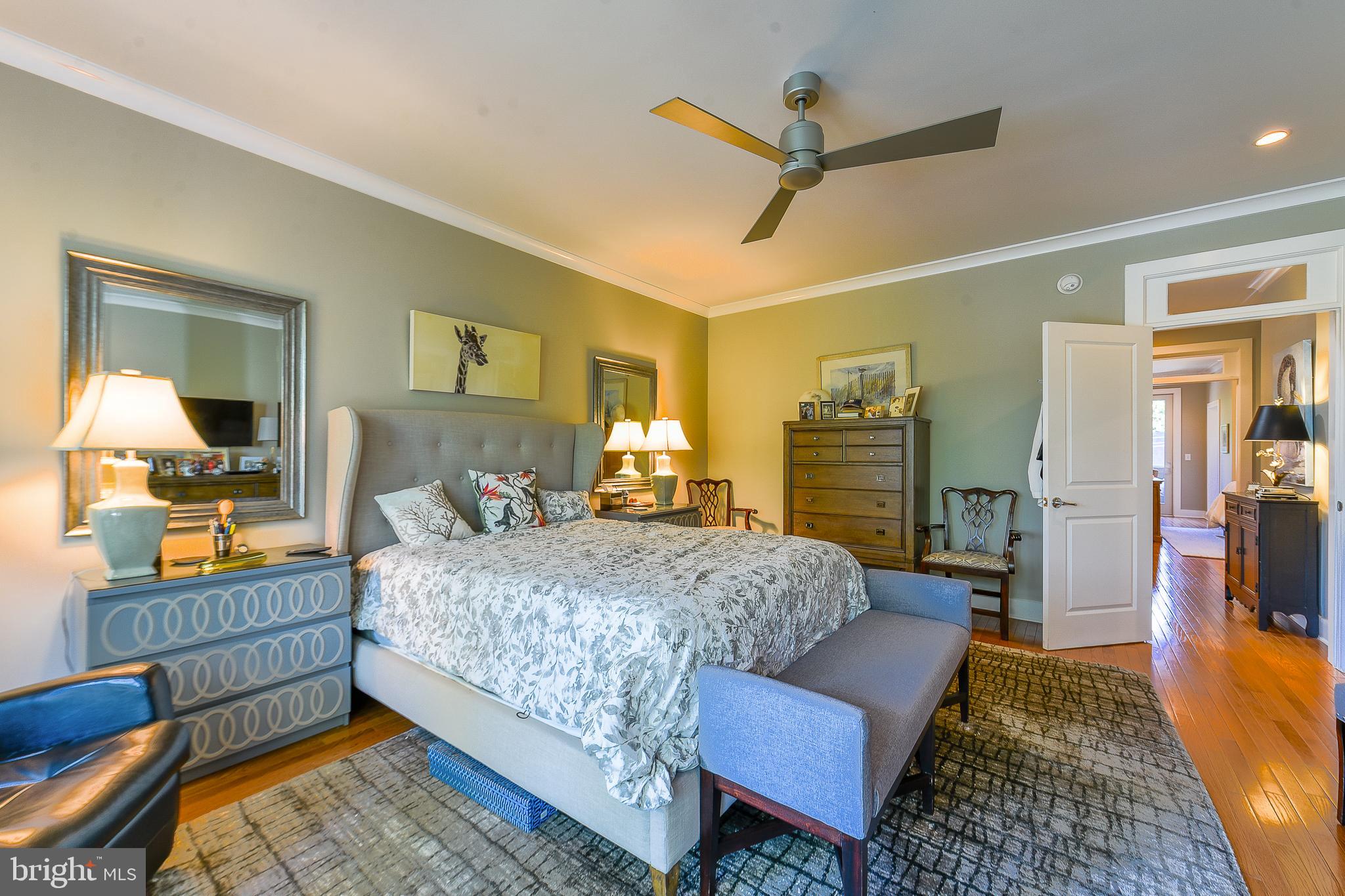 38520 Pine Lane, Unit 2 Rehoboth Beach, DE 19971 - Photo 41 of 71 a bedroom with a bed and wooden floor