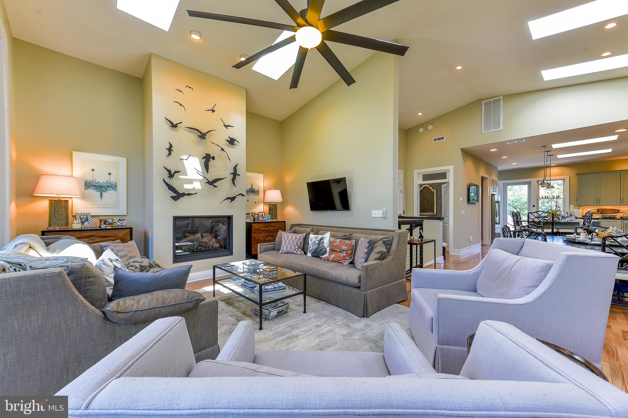 38520 Pine Lane, Unit 2 Rehoboth Beach, DE 19971 - Photo 6 of 71 a living room with furniture and a fireplace