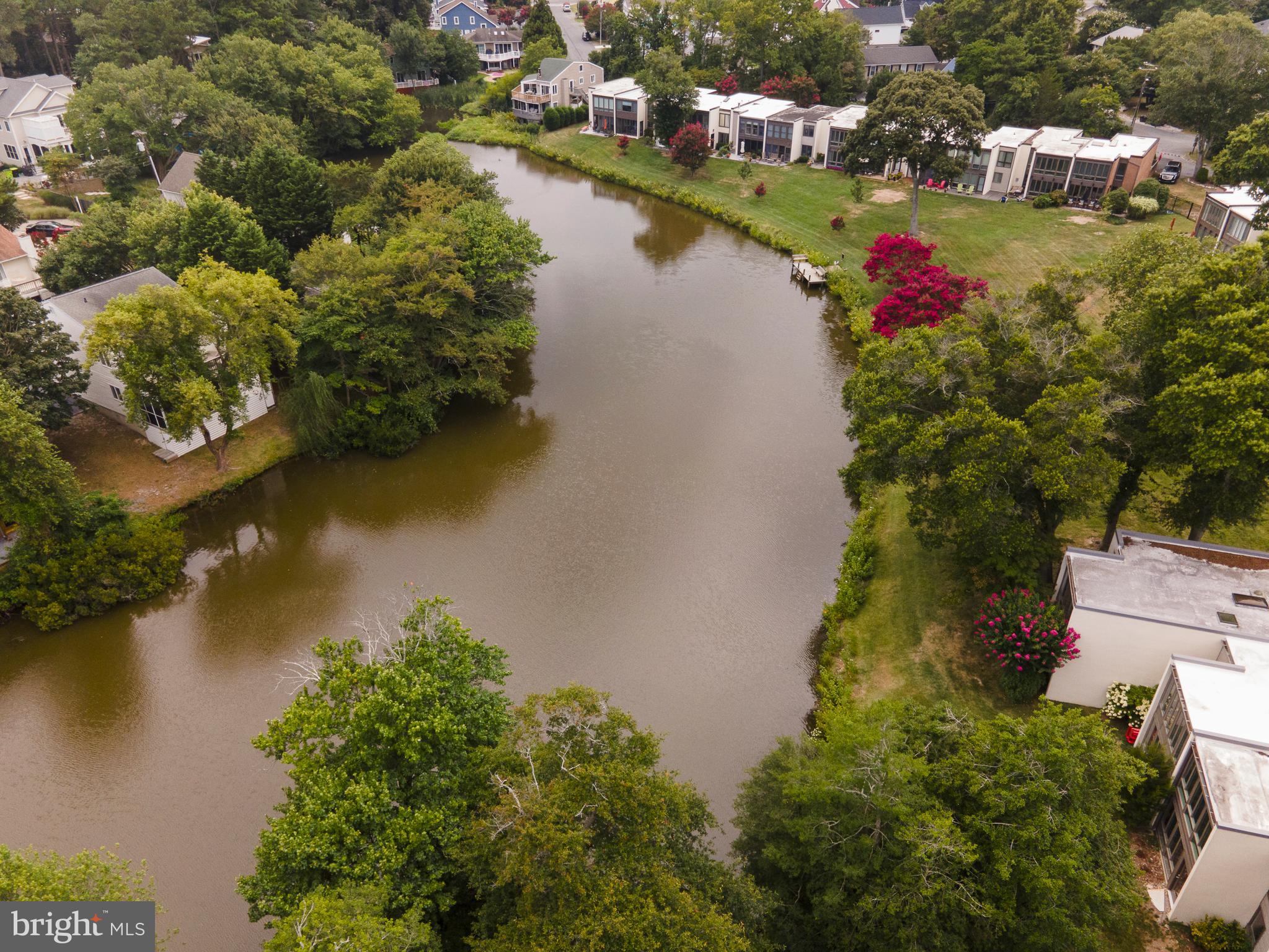 38520 Pine Lane, Unit 2 Rehoboth Beach, DE 19971 - Photo 63 of 71 an aerial view of residential houses with outdoor space and lake view
