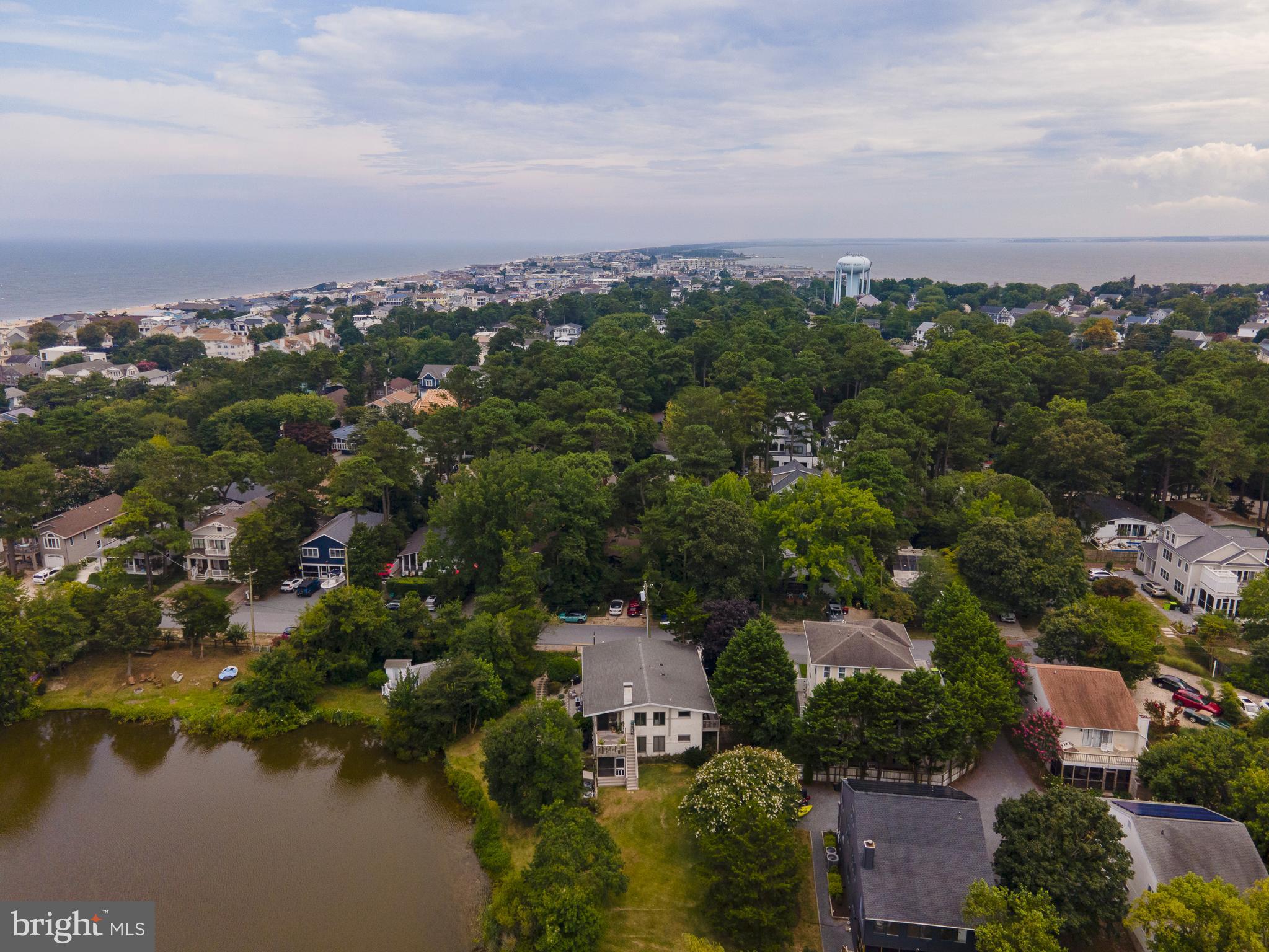 38520 Pine Lane, Unit 2 Rehoboth Beach, DE 19971 - Photo 66 of 71 an aerial view of a city with lots of residential buildings lake and mountain view in back
