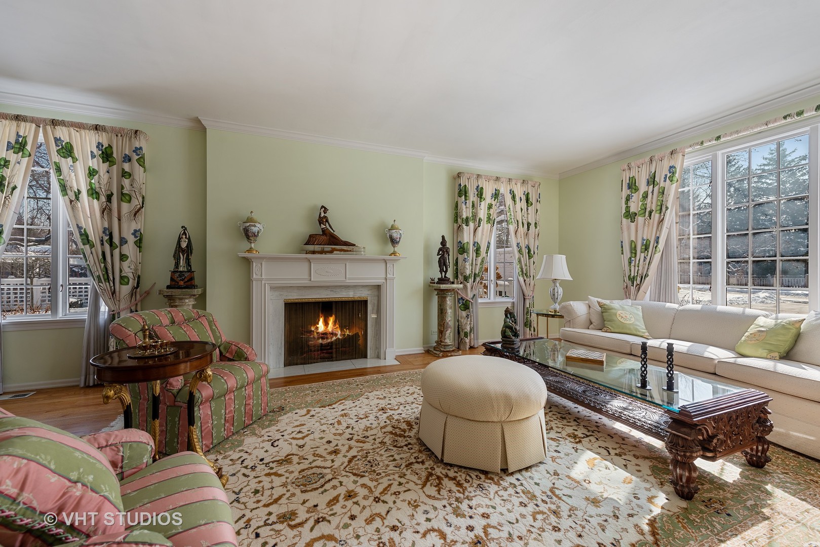 315 Woodley Road Winnetka, IL 60093 - Photo 4 of 28 a living room with furniture and a fireplace