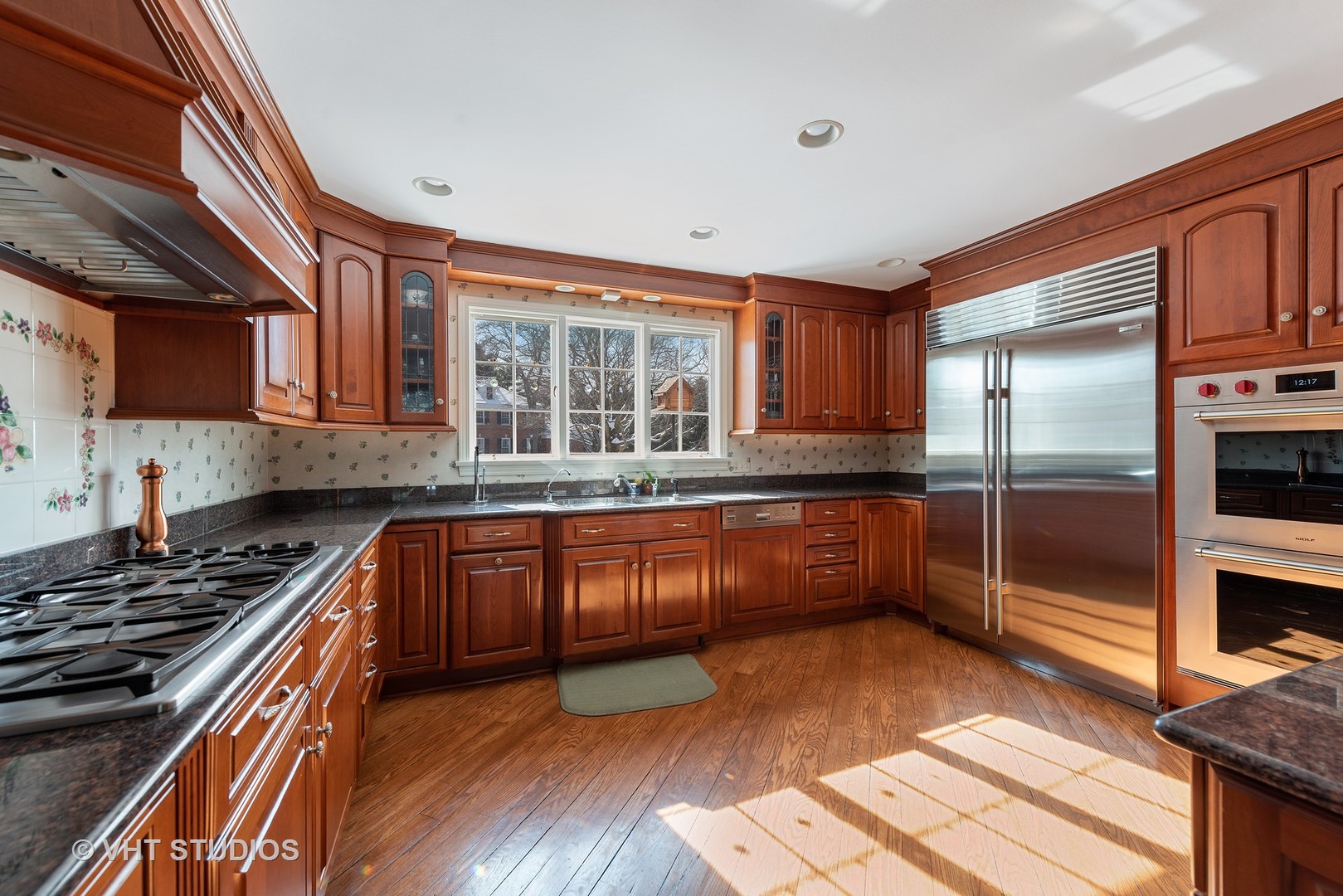 315 Woodley Road Winnetka, IL 60093 - Photo 5 of 28 a kitchen with granite countertop a stove and a sink