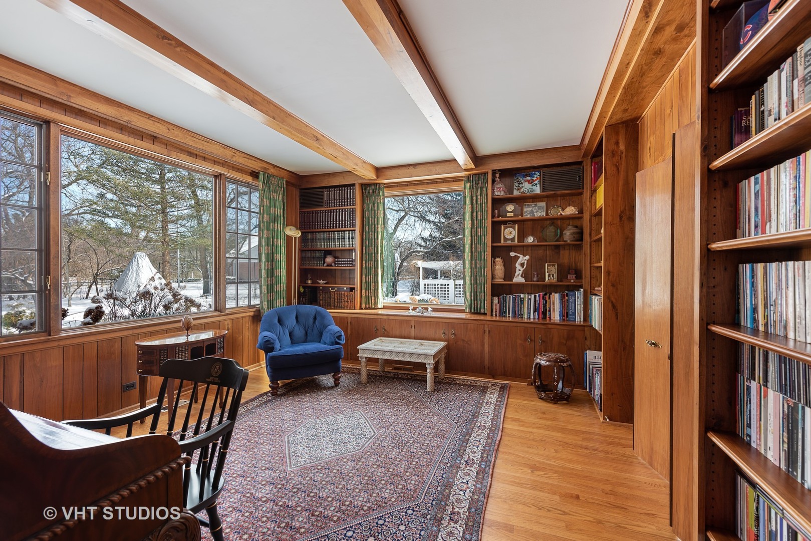 315 Woodley Road Winnetka, IL 60093 - Photo 7 of 28 a living room with furniture a bookshelf and a window