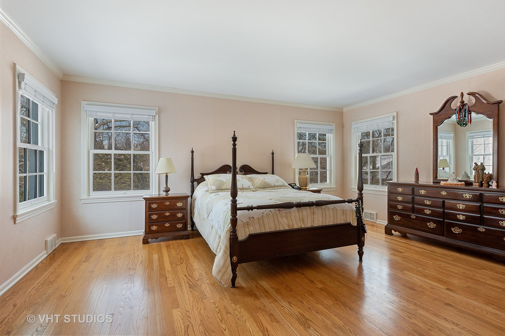 315 Woodley Road Winnetka, IL 60093 - Photo 8 of 28 a bedroom with a bed and wooden floor