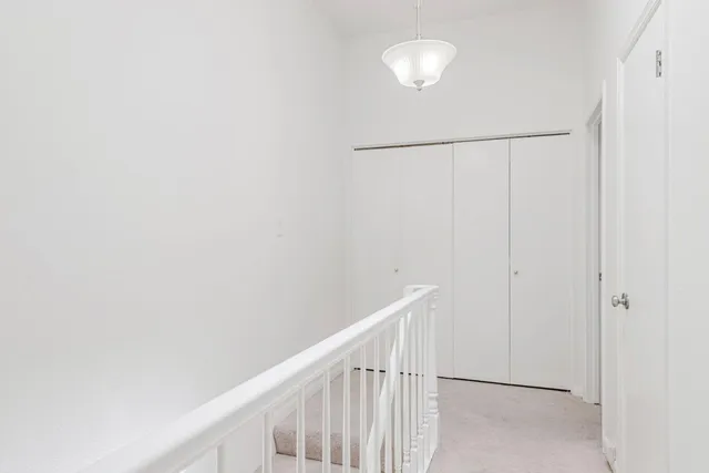 a bedroom with a bed and a chair