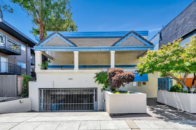 a view of front door and potted plants
