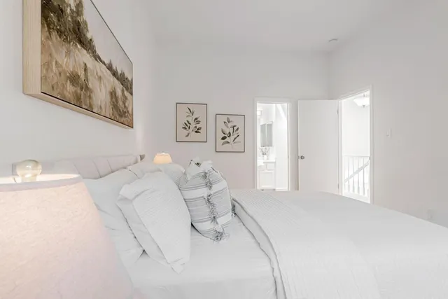 a bedroom with a bed and a couch