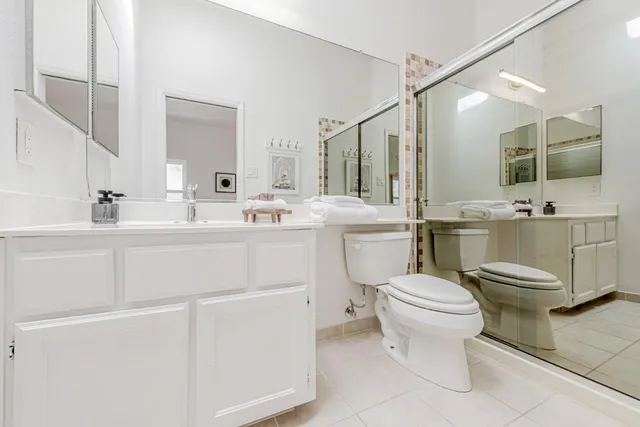 a bathroom with a sink a vanity and mirror